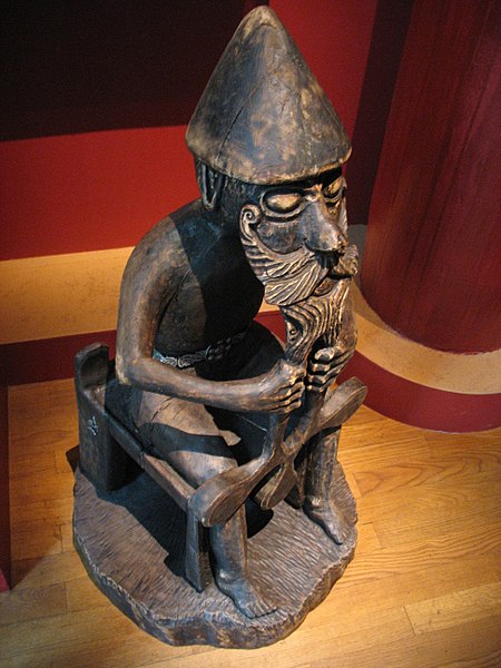 A reproduction in wood of an Icelandic original known as the Eyrarland statue depicting the Germanic war and thunder god Thor, displayed at the Swedish Army Museum.
