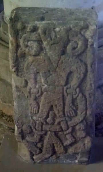 The Norse god Loki carved on a stone at Saint Stephen's church, Kirkby Stephen, Cumbria, England.